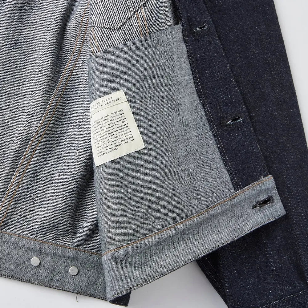 Inside label of the Old Joe Curved Flap Jean Jacket Indigo showing branding, size information, and garment identification for Clothier & Sons.