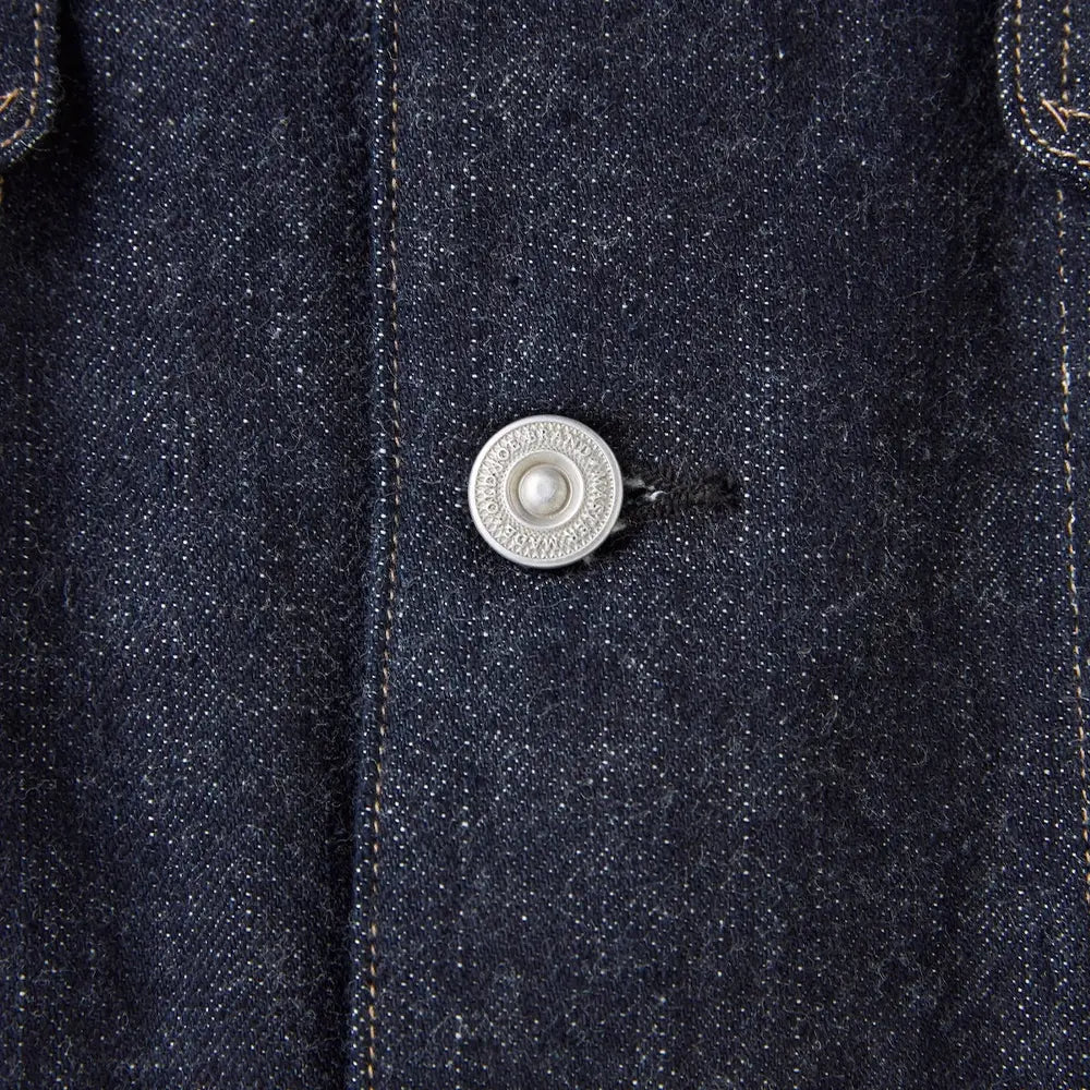 Side profile of the Old Joe Curved Flap Jean Jacket Indigo showing jacket length, sleeve shape, and structured denim fit for Clothier & Sons.
