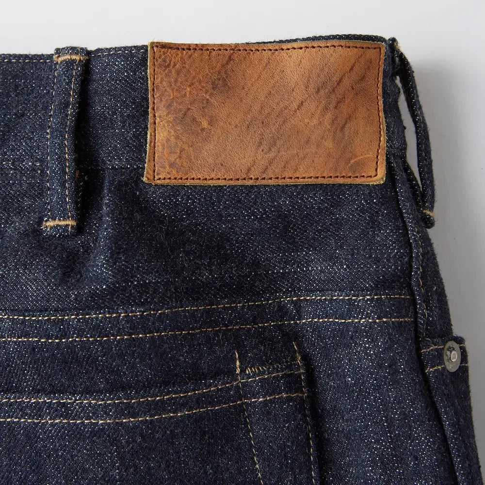 Inside label of the Old Joe Saddle Straight Jean Trouser 945 Indigo showing branding, size information, and garment identification for Clothier & Sons.