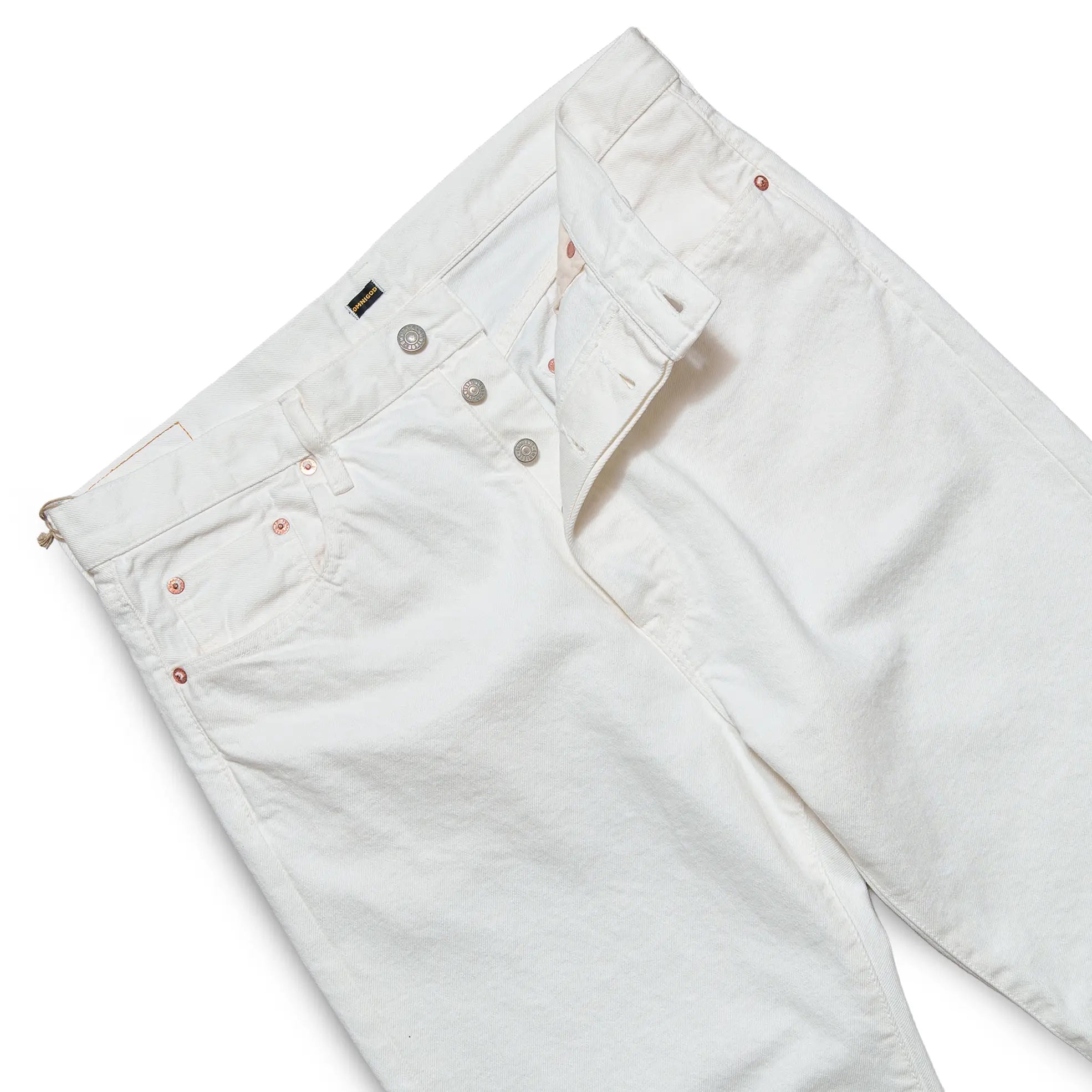 Waist detail of the Omnigod Clothier & Sons Selvedge White Jeans showing waistband construction, belt loops, and stitching finish for Clothier & Sons.
