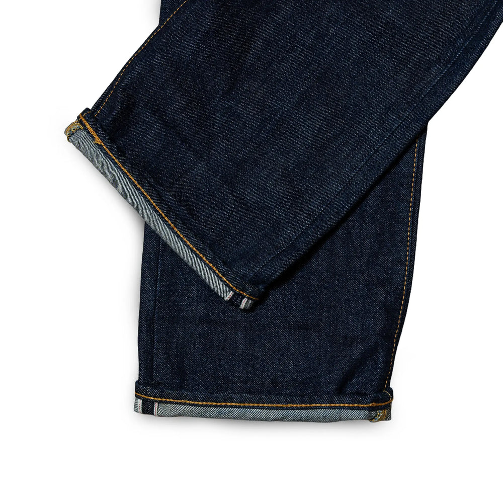 Fabric detail of the Omnigod Clothier & Sons Selvedge One Wash Jeans revealing Japanese selvedge denim texture, one wash surface character, and depth of indigo tone for Clothier & Sons.