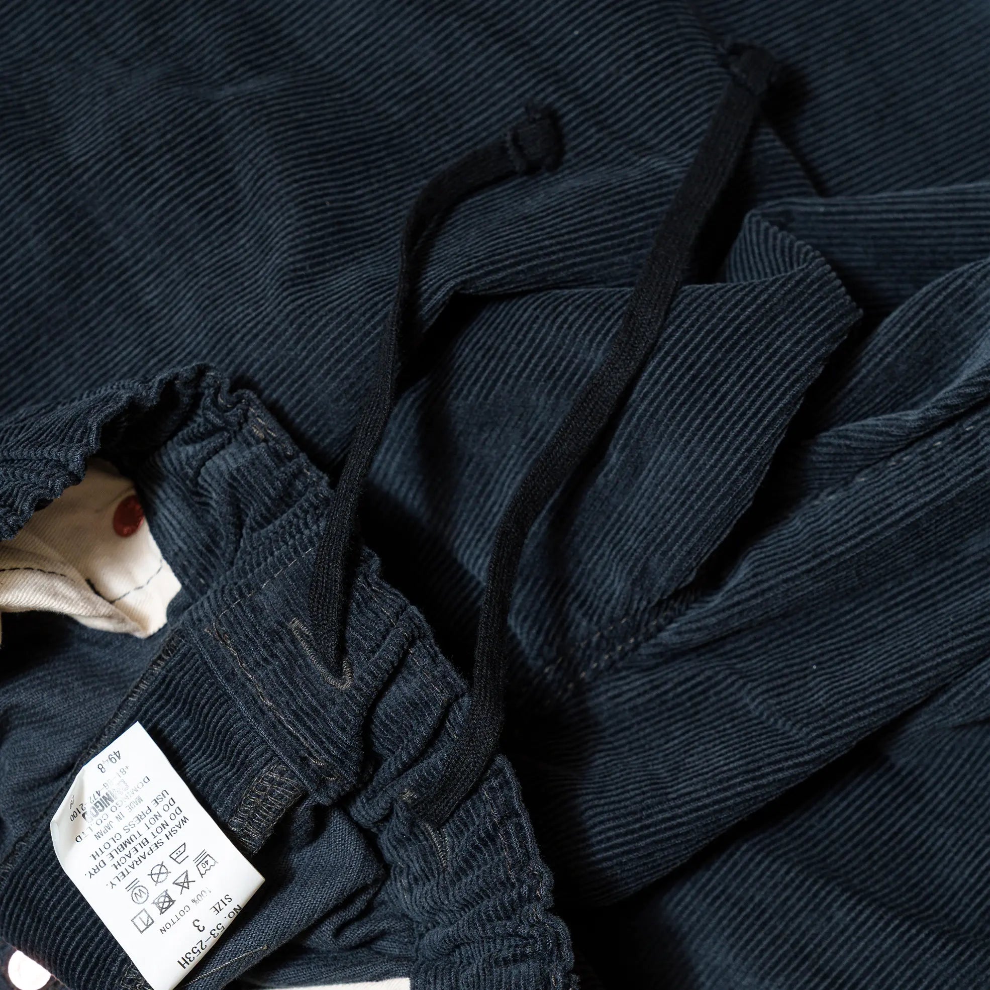 Waist detail of the Omnigod Men’s 14W Corduroy 5-Piece Easy Loose Jeans Gray showing waistband construction, belt loops, and stitching finish for Clothier & Sons.