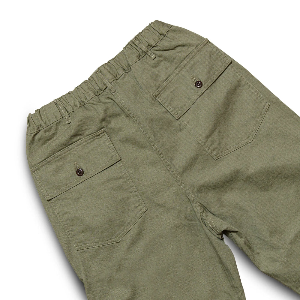 Back view of the Omnigod Men’s Herringbone Easy Baker Pants Olive highlighting rear pocket placement, relaxed fit, and subtle herringbone texture for Clothier & Sons.