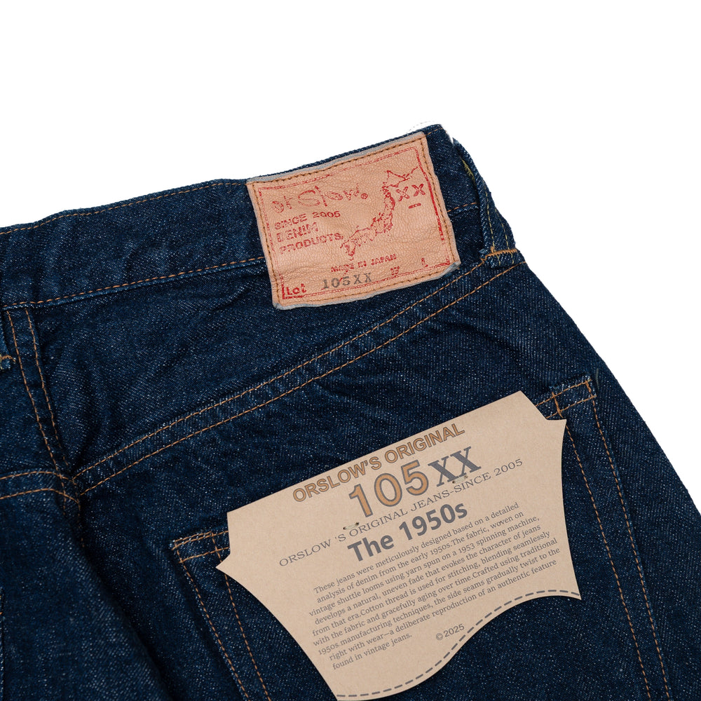 ป้ายหนังด้านหลังของ Orslow 105XX The 1950s Selvedge Denim One Wash พร้อมโลโก้แบรนด์และรายละเอียดไซซ์