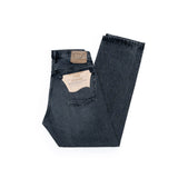 Half-fold view of the Orslow 105 Selvedge Black Stonewashed jeans showing the straight silhouette, denim texture, and stonewashed finish.