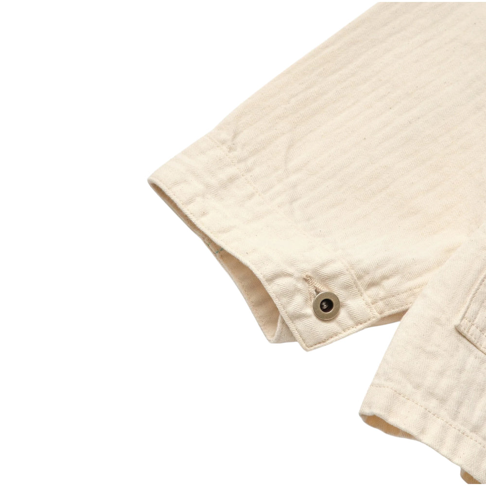 Cuff detail of the Post O’Alls 3114R-MH4 USMC 1930s Utility Jacket Mini HBT Natural showing buttoned cuff construction and mini hbt fabric texture for Clothier & Sons.