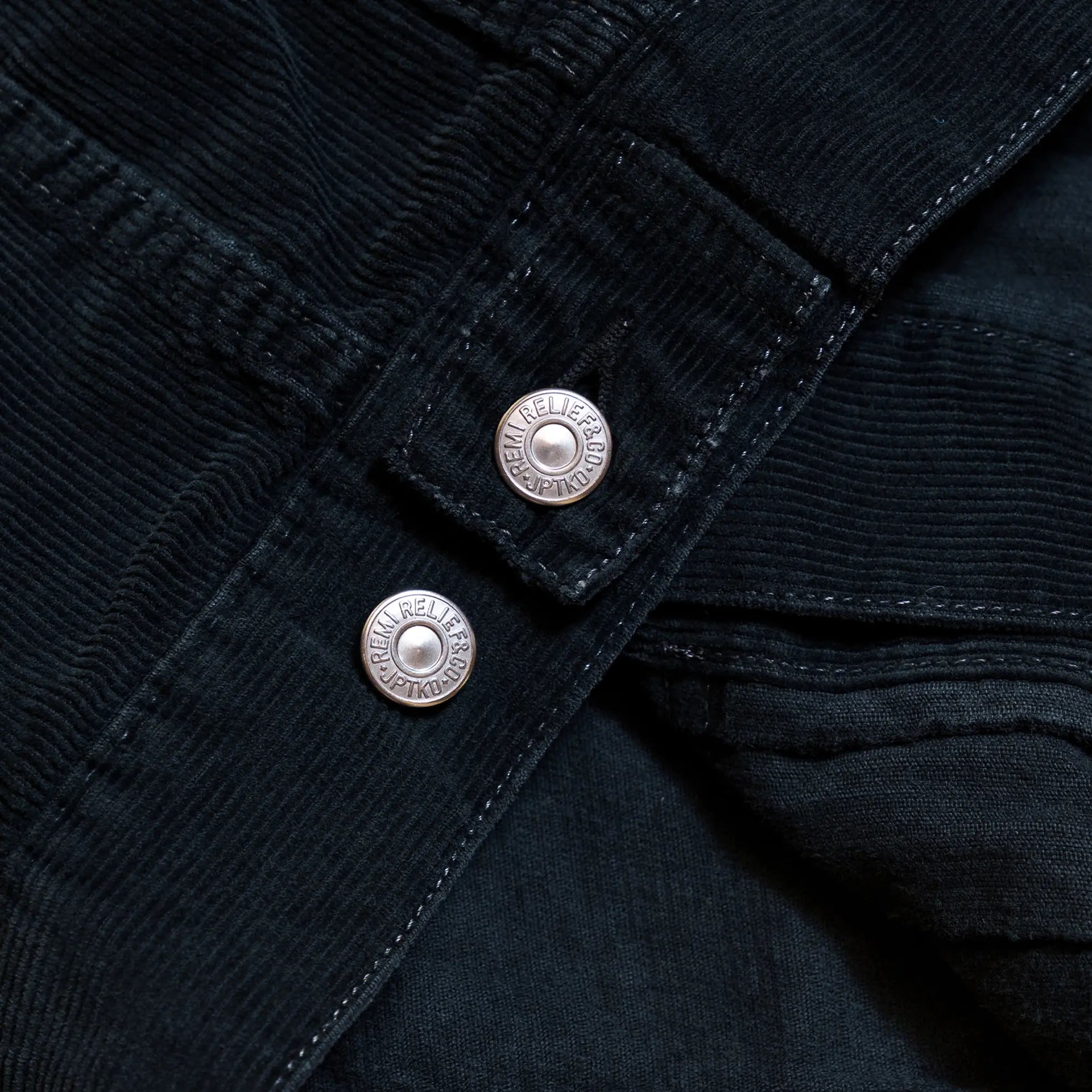 stitching detail of the Remi Relief 14W Corduroy 2nd Jacket in Black highlighting precise construction and workmanship for Clothier & Sons.
