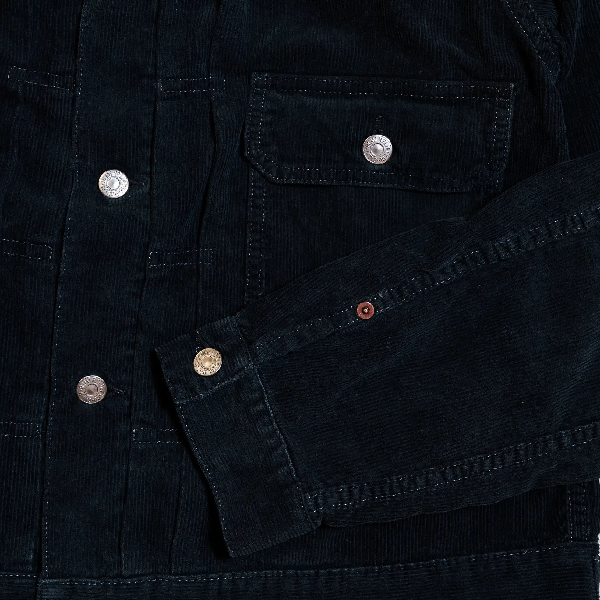 Pocket and stitching detail of the Remi Relief 14W Corduroy 2nd Jacket in Black highlighting precise construction and workmanship for Clothier & Sons.