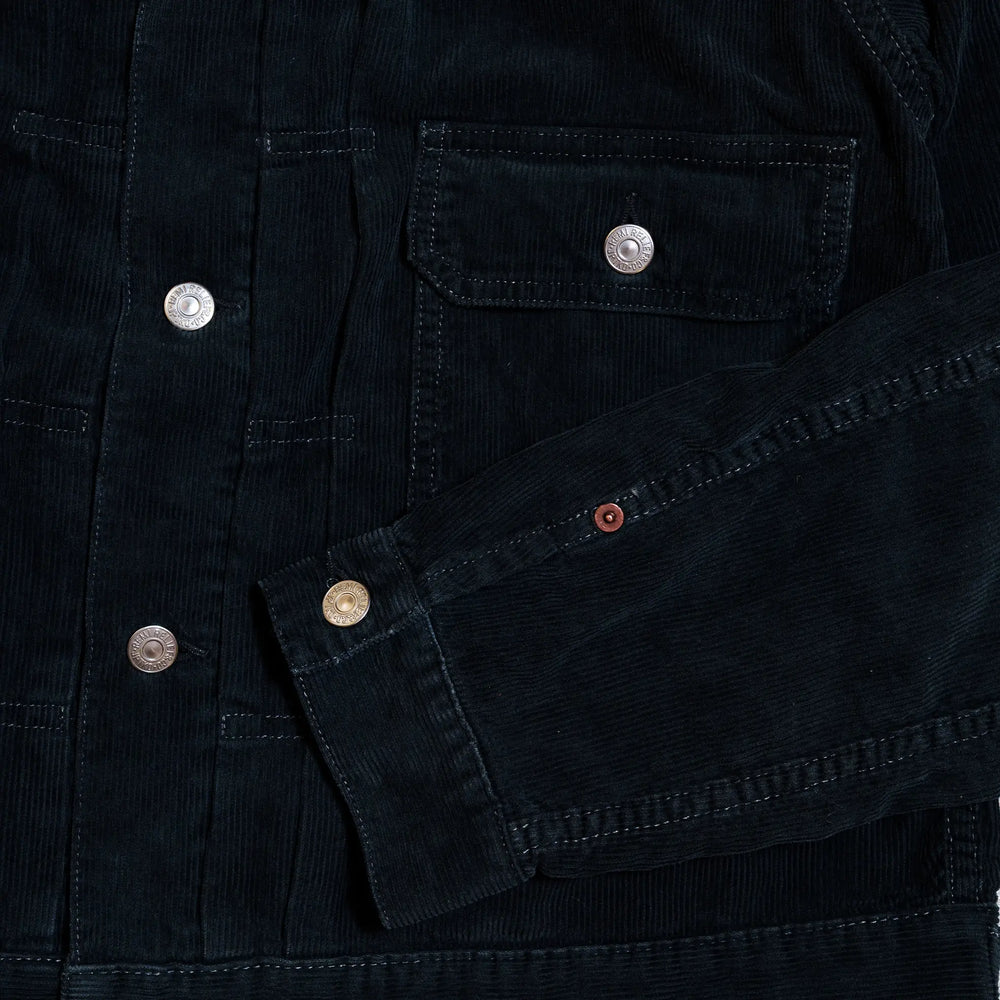 Pocket and stitching detail of the Remi Relief 14W Corduroy 2nd Jacket in Black highlighting precise construction and workmanship for Clothier & Sons.