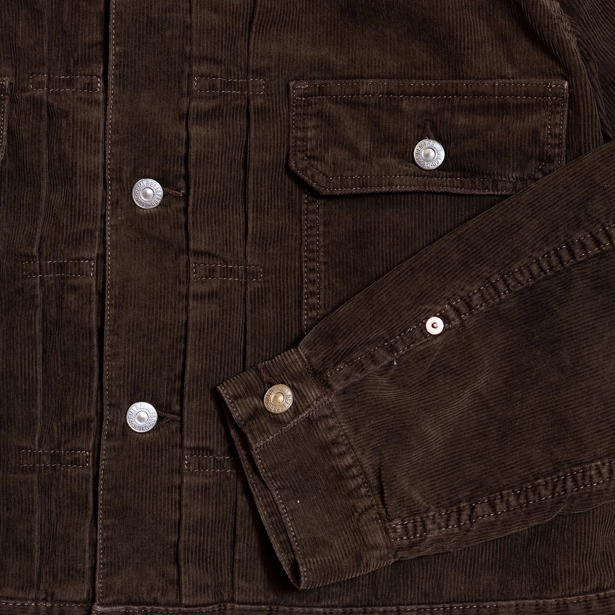 Pocket and stitching detail of the Remi Relief 14W Corduroy 2nd Jacket in Brown highlighting precise construction and workmanship for Clothier & Sons.