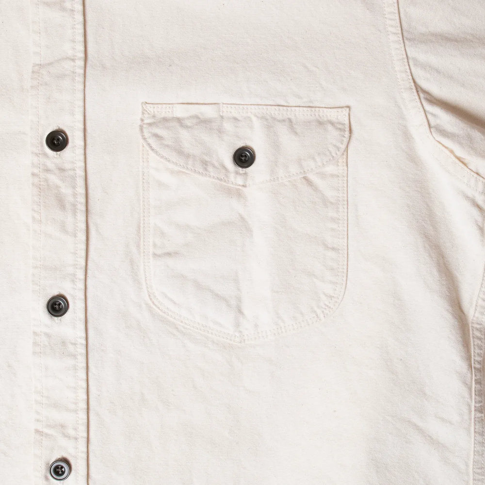 Close-up of button fastening and reinforced stitching on Seuvas 8oz Canvas Flap Work Shirt in natural.