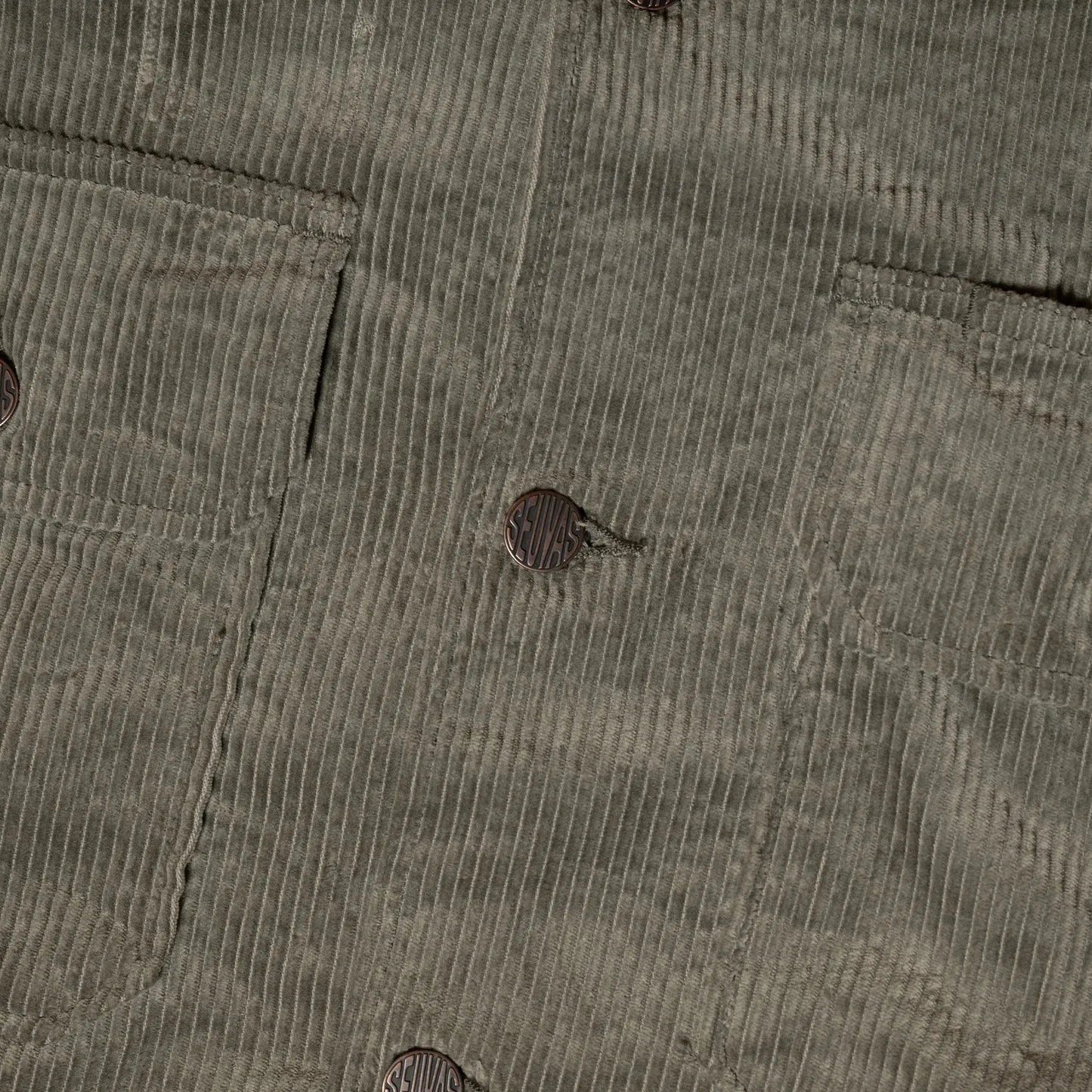 Close-up of button fastening and stitching detail on Seuvas Corduroy CPO Shirt in sage.