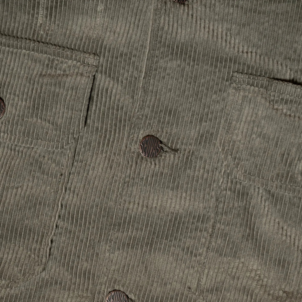 Close-up of button fastening and stitching detail on Seuvas Corduroy CPO Shirt in sage.