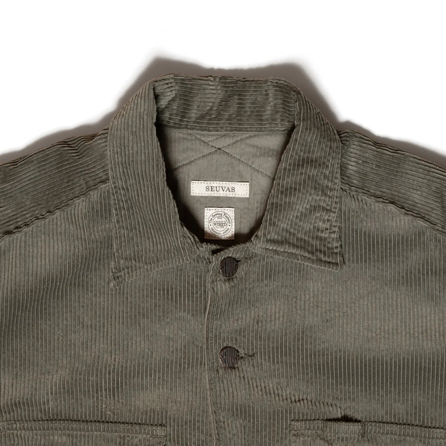 Close-up of spread collar and topstitching on Seuvas Corduroy CPO Shirt in sage.
