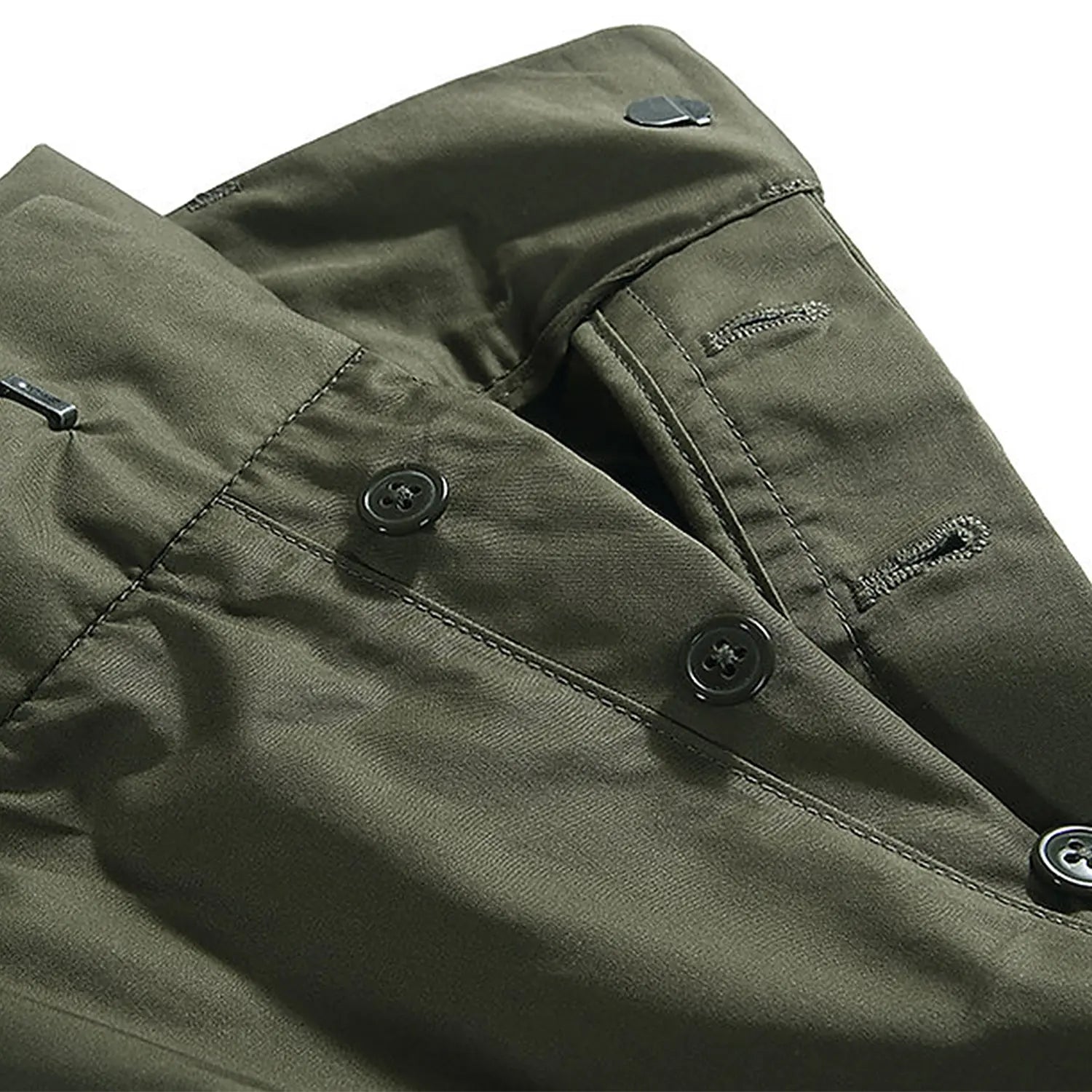 Waist detail of the Standard Types Pleated Chino Shorts Green showing waistband construction, belt loops, and fastening detail for Clothier & Sons.