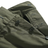 Waist detail of the Standard Types Pleated Chino Shorts Green showing waistband construction, belt loops, and fastening detail for Clothier & Sons.