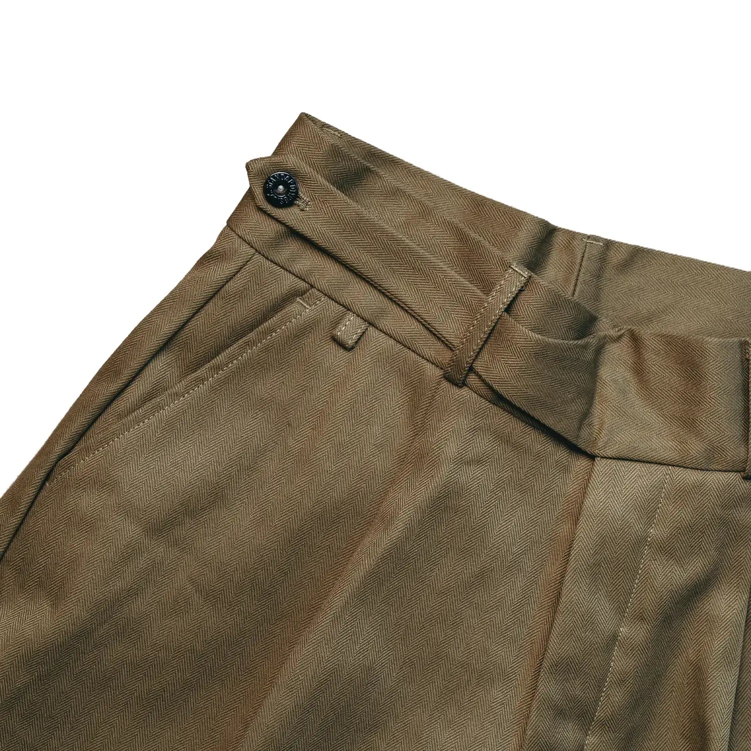 Waist detail of the StandardTypes Pleated Chino Shorts HBT Green showing waistband construction, belt loops, and fastening detail for Clothier & Sons.
