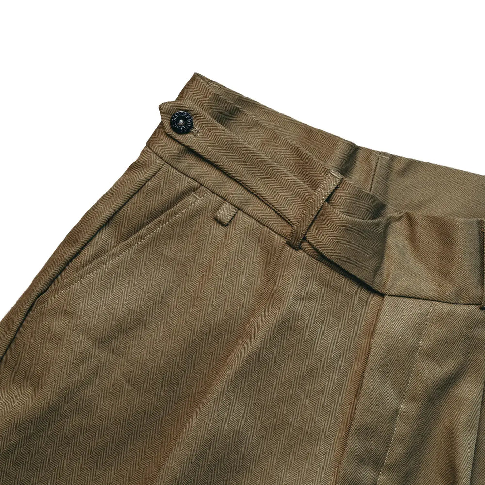 Waist detail of the StandardTypes Pleated Chino Shorts HBT Green showing waistband construction, belt loops, and fastening detail for Clothier & Sons.

