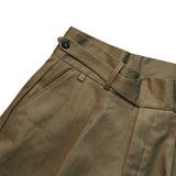 Waist detail of the StandardTypes Pleated Chino Shorts HBT Green showing waistband construction, belt loops, and fastening detail for Clothier & Sons.
