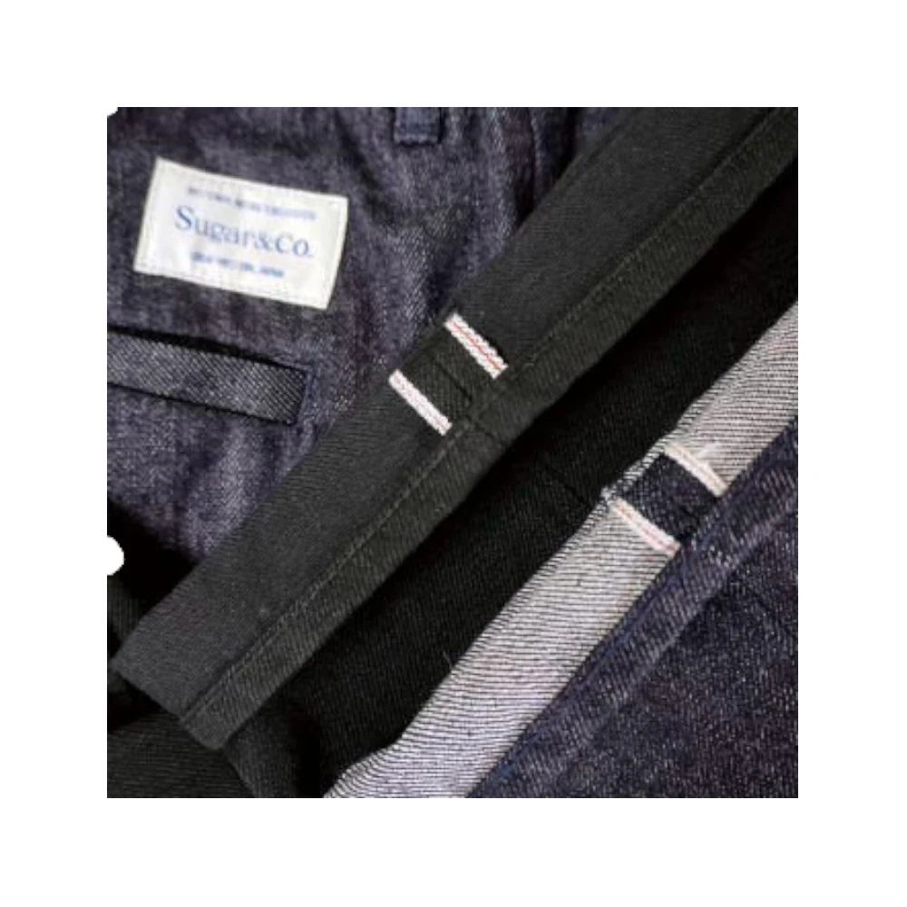 Fabric detail of the Sugar & Co. SGR-S01 Gentle Pants Indigo revealing indigo-dyed fabric texture, weave density, and natural color depth for Clothier & Sons.