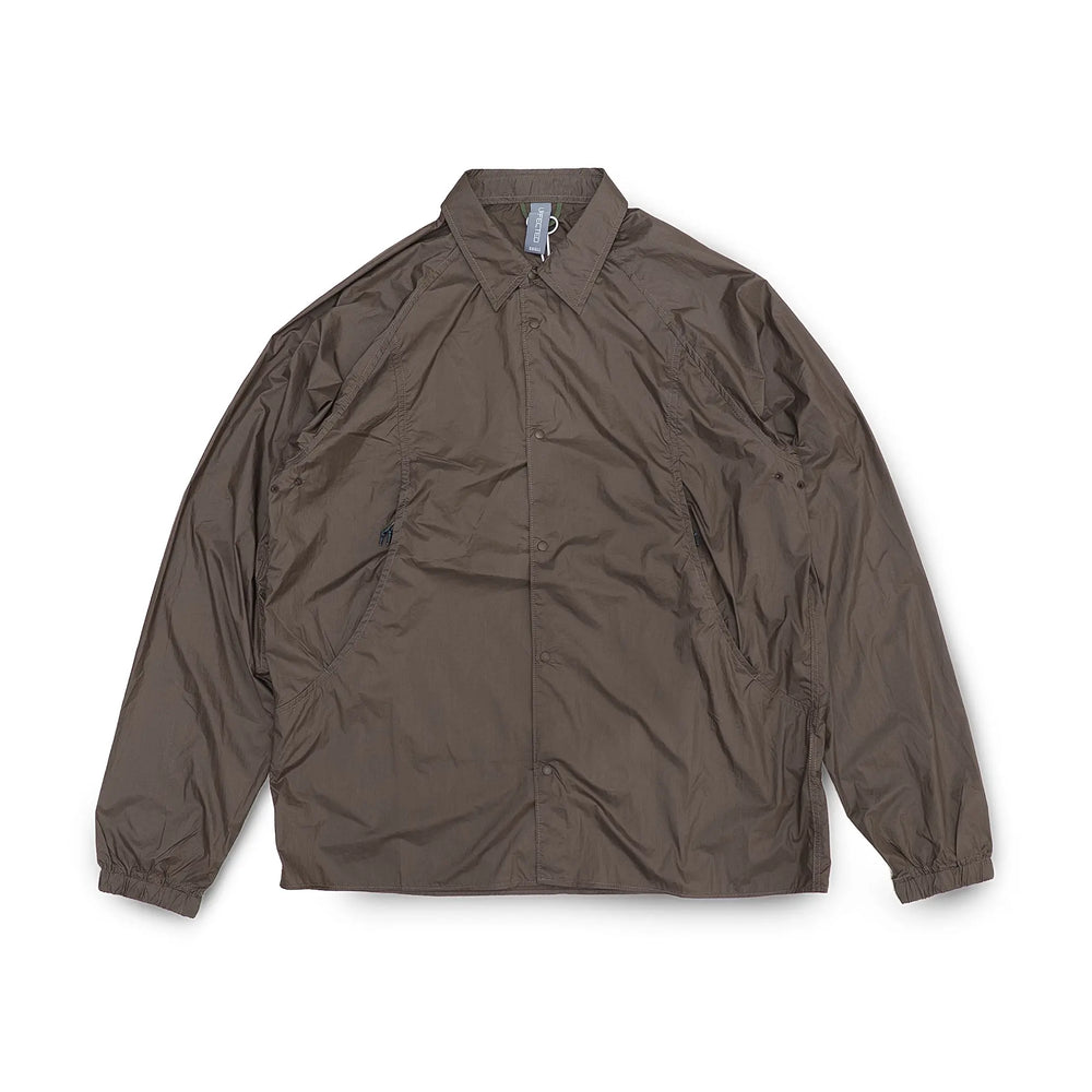 Front view of the Unaffected Blouson Track Shirt Charcoal Brown showing the blouson silhouette, charcoal brown tone, and minimal contemporary design for Clothier & Sons.