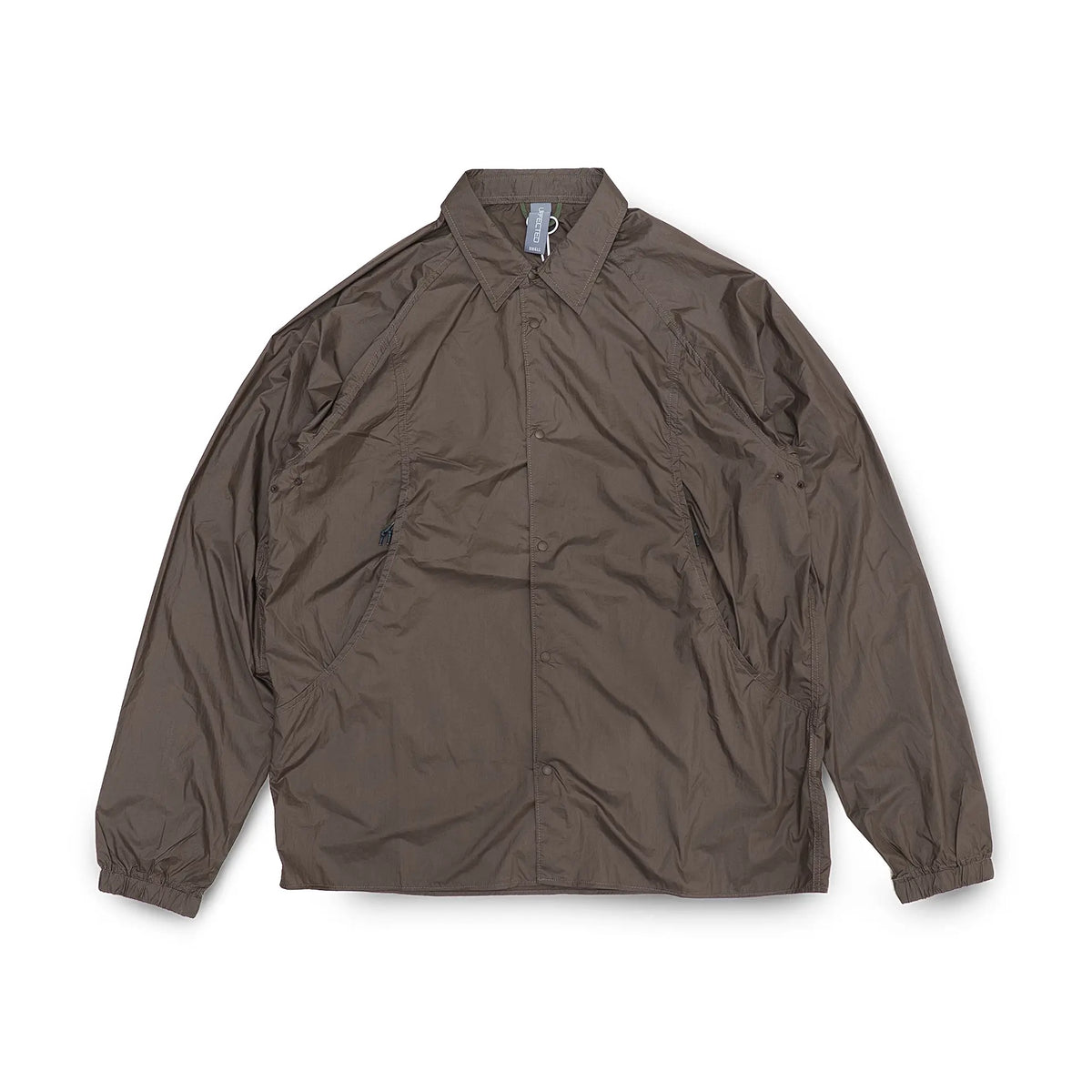 Front view of the Unaffected Blouson Track Shirt Charcoal Brown showing the blouson silhouette, charcoal brown tone, and minimal contemporary design for Clothier & Sons.