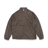 Front view of the Unaffected Blouson Track Shirt Charcoal Brown showing the blouson silhouette, charcoal brown tone, and minimal contemporary design for Clothier & Sons.