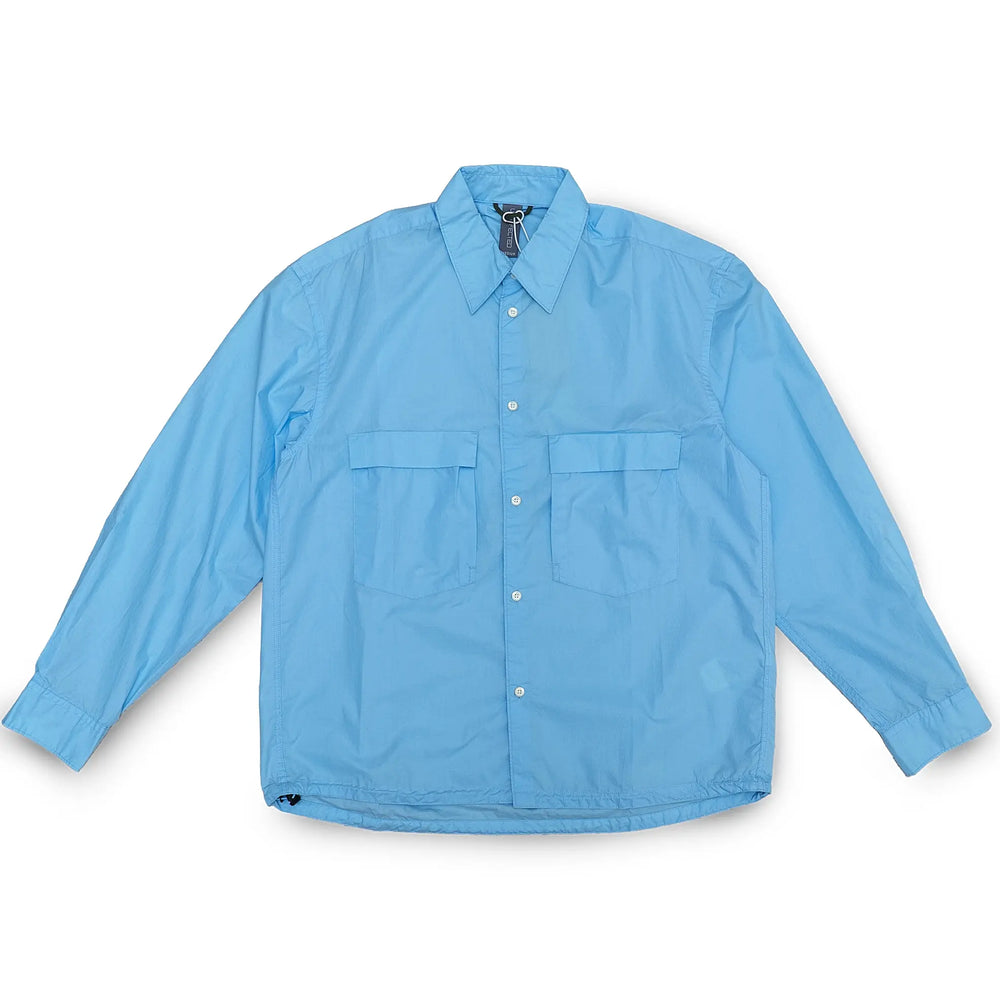 Front view of the Unaffected Drawstring Shirt Blue showing the relaxed shirt silhouette, blue tone, and adjustable drawstring hem for Clothier & Sons.