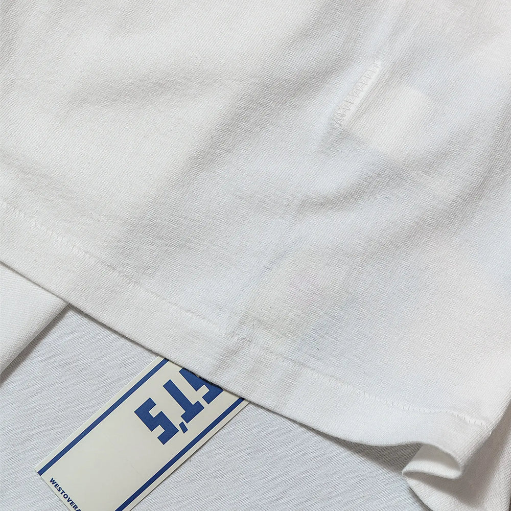 Fabric detail of the Westoverall Box Logo Print T-shirt White revealing cotton knit texture, soft hand feel, and fabric grain for Clothier & Sons.