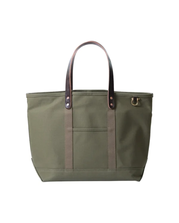 Utility tote bag in olive green 15oz canvas with English bridle leather handles and brass hardware, designed for everyday use with a rugged, functional style.