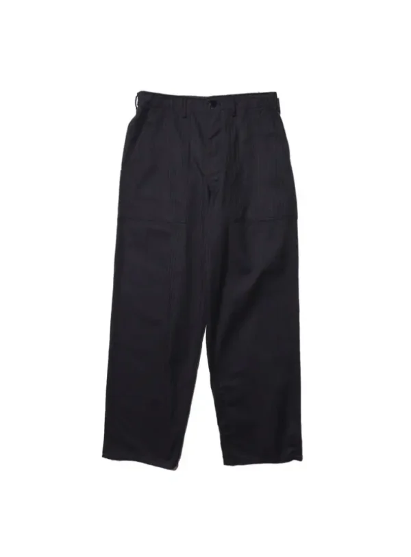 A detailed view of Baker Pants made from herringbone twill fabric, showcasing their firm texture, large side cargo pocket, and urea buttons, faithfully reproducing the U.S. military style from 1947.