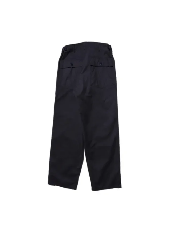 A detailed view of Baker Pants made from herringbone twill fabric, showcasing their firm texture, large side cargo pocket, and urea buttons, faithfully reproducing the U.S. military style from 1947.