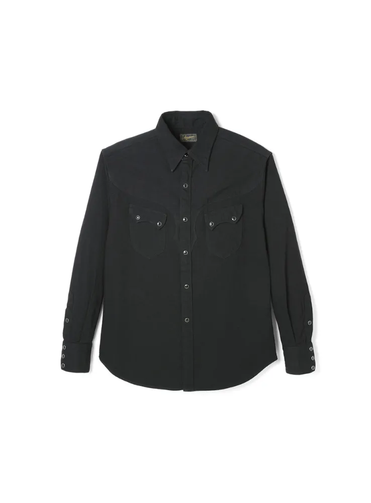 Cody western shirt with relaxed fit, featuring front yoke and wing-shaped back yoke. Made from 7.5oz black Zimbabwe cotton denim with soft yet structured texture.
