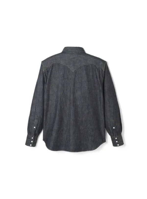 A modernized western-style shirt with a relaxed fit through the body, shoulders, and neck. Features signature details like a pointed front yoke and buffalo horn-inspired wing-shaped back yoke. Made from 8oz slub denim woven with Zimbabwe cotton, offering a soft yet structured feel.”